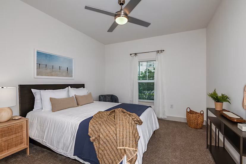 Bedroom with modern furnishings at Grand Cypress Apartments featuring luxury design