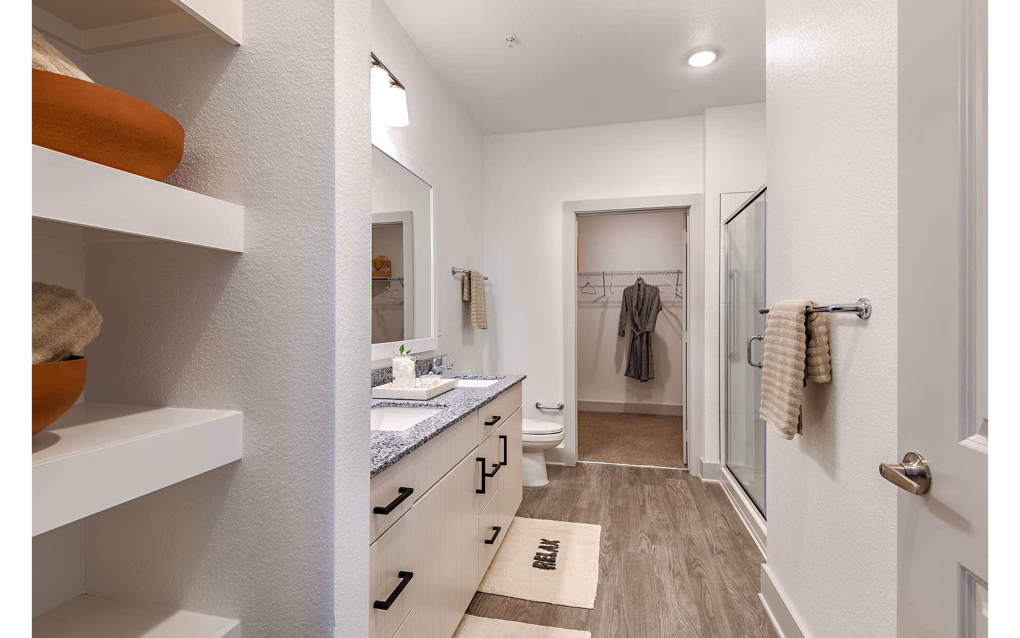Modern bathroom featuring sleek fixtures and spacious layout in Grand Cypress Apartments, a luxury residence in a prime location