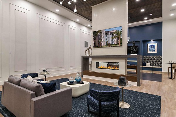 Stylish clubhouse with plush seating at Grand Cypress Apartments, a feature of luxury living