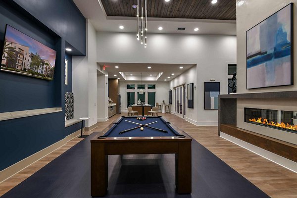 Clubhouse featuring modern design and spacious seating at Grand Cypress Apartments