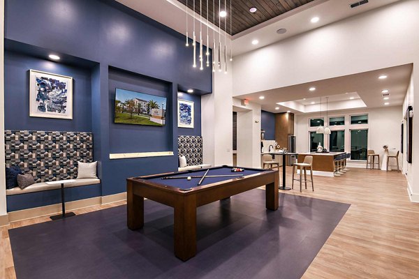 Spacious clubhouse with modern decor at Grand Cypress Apartments, featuring luxurious social and event spaces