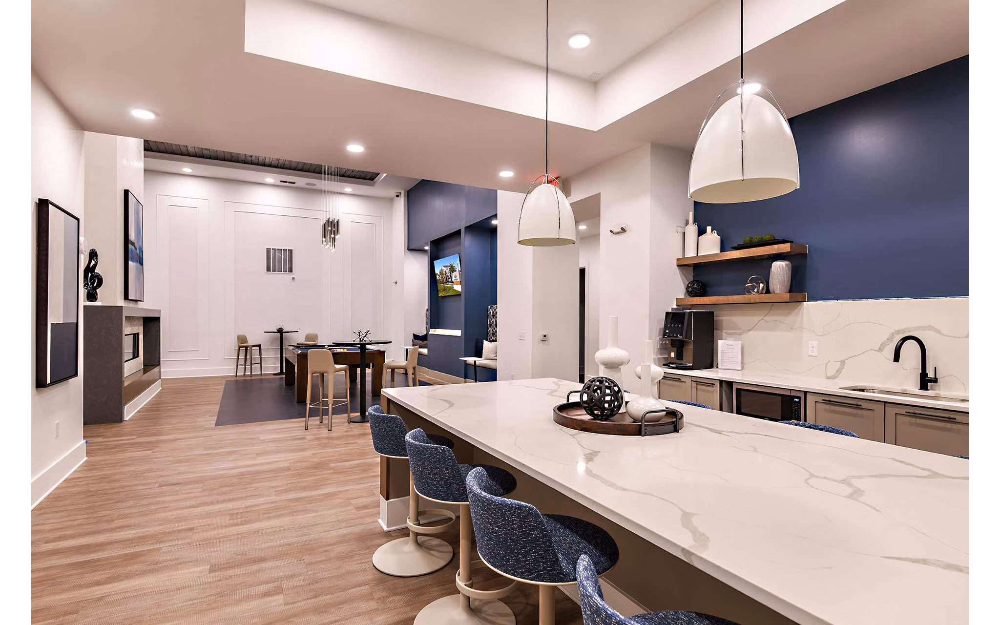 Clubhouse with modern furnishings and vibrant decor at Grand Cypress Apartments, a premier luxury community