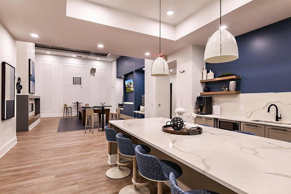 Clubhouse with modern furnishings and vibrant decor at Grand Cypress Apartments, a premier luxury community