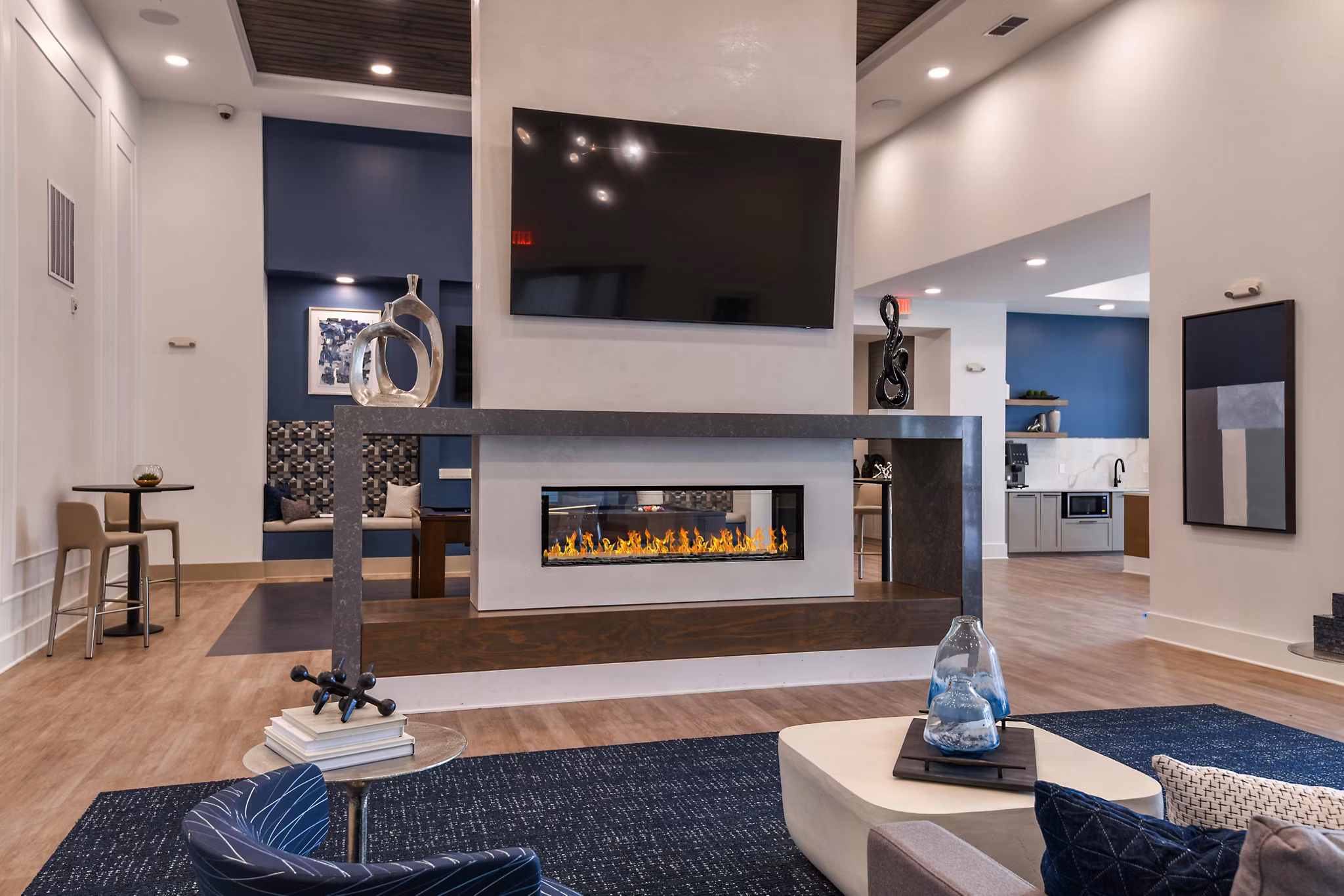 Grand Cypress Apartments: Modern clubhouse with elegant interior design and comfortable seating areas in a luxury community