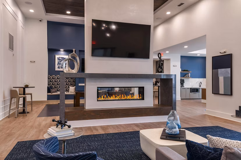Grand Cypress Apartments: Modern clubhouse with elegant interior design and comfortable seating areas in a luxury community