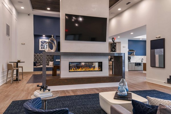 Grand Cypress Apartments: Modern clubhouse with elegant interior design and comfortable seating areas in a luxury community