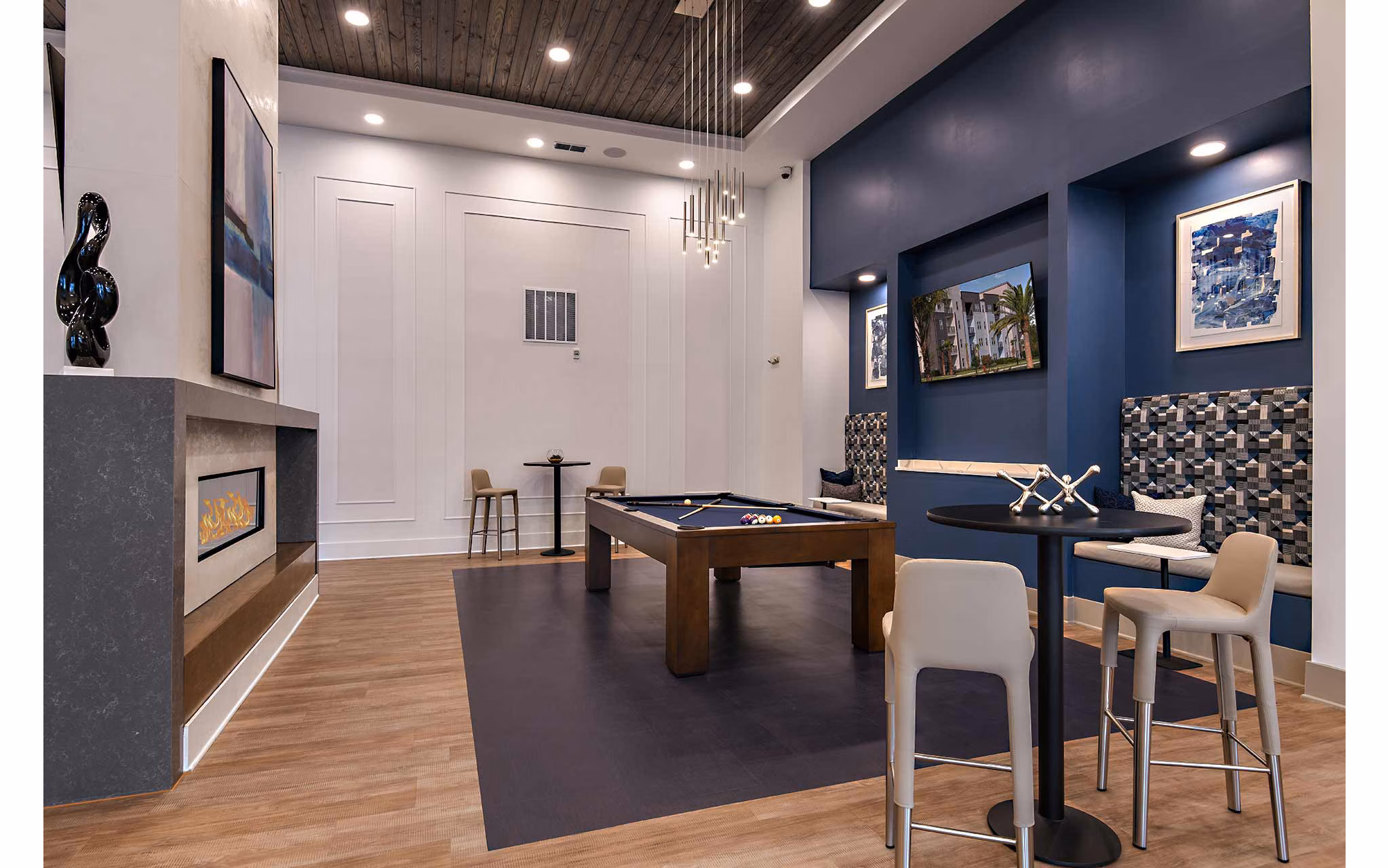 Clubhouse with modern decor and seating areas at Grand Cypress Apartments