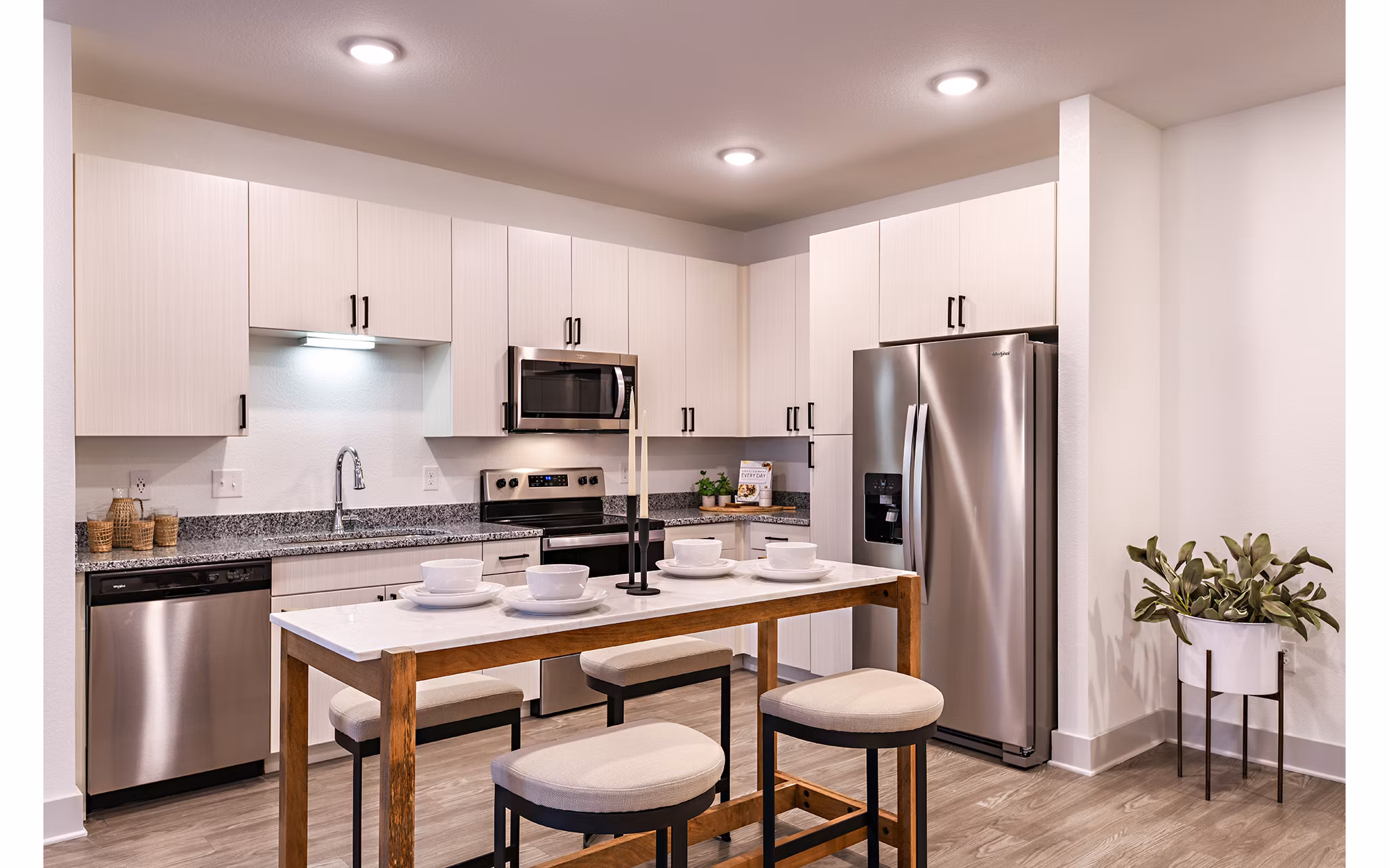 Modern kitchen featuring stainless steel appliances at Grand Cypress Apartments