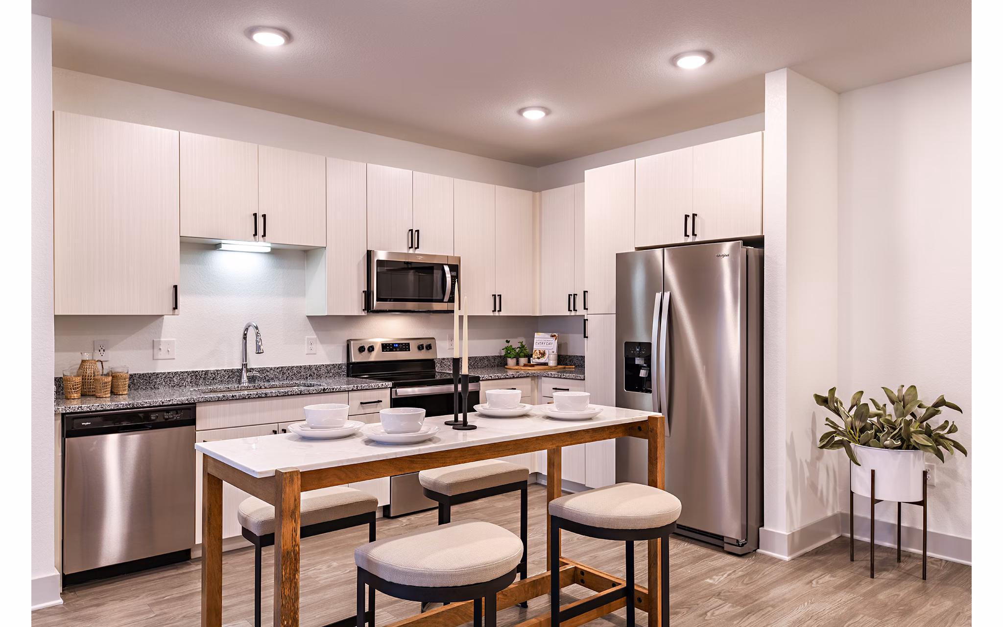 Modern kitchen featuring stainless steel appliances at Grand Cypress Apartments