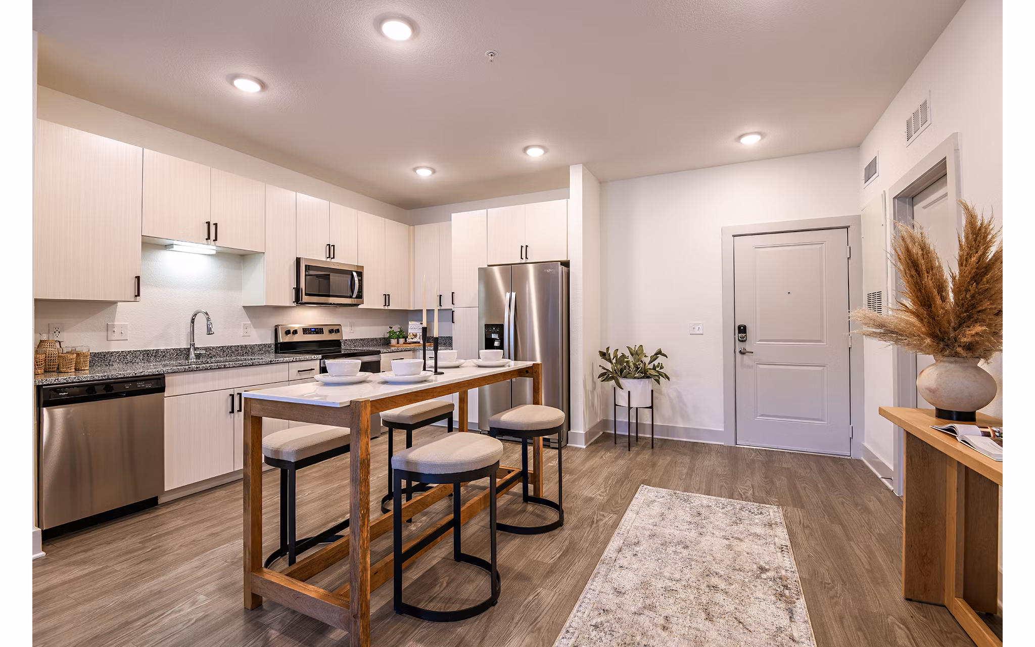 Modern kitchen with sleek appliances at Grand Cypress Apartments