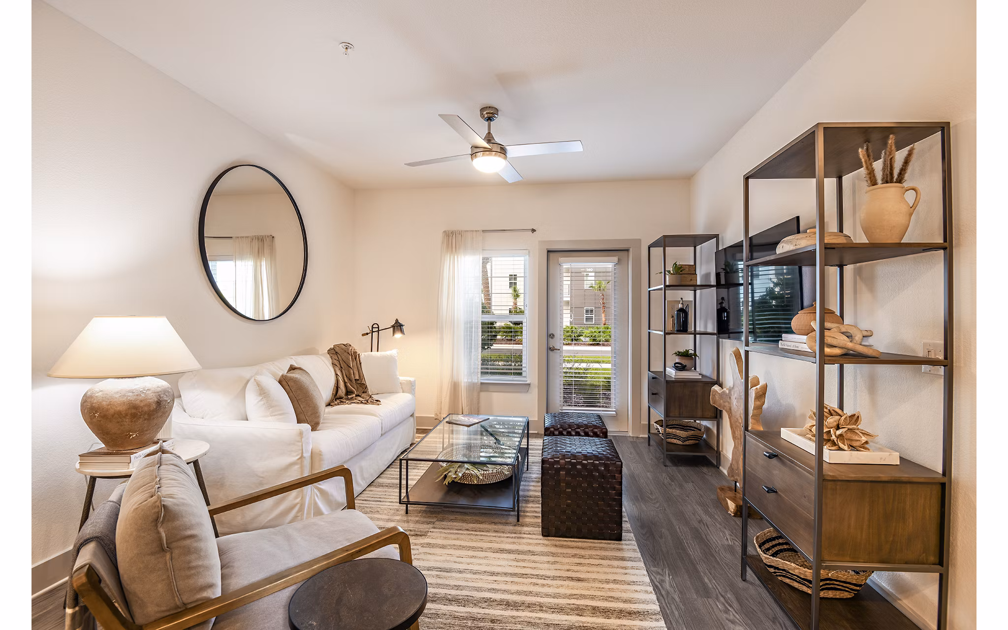 Modern living room with stylish furnishings in Grand Cypress Apartments, a luxury property managed by Greystar