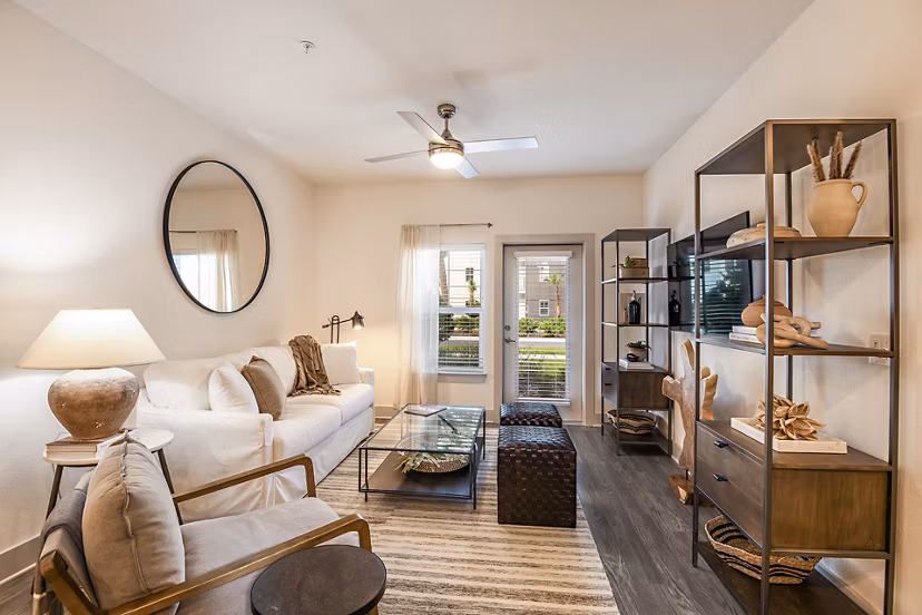 Modern living room with stylish furnishings in Grand Cypress Apartments, a luxury property managed by Greystar