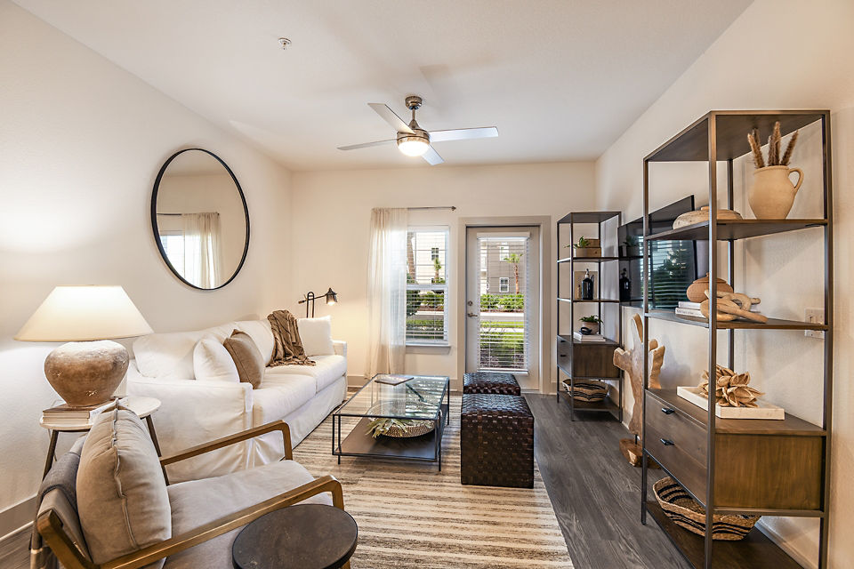 Modern living room with stylish furnishings in Grand Cypress Apartments, a luxury property managed by Greystar