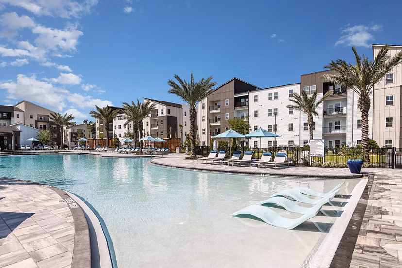 Elegant pool area with cabanas at Grand Cypress Apartments offering luxury amenities in a serene environment
