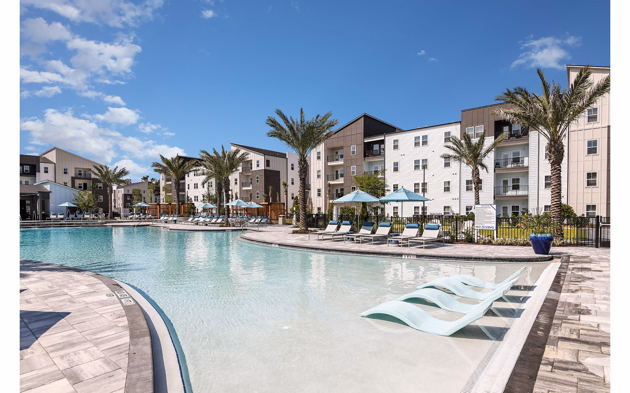 Elegant pool area with cabanas at Grand Cypress Apartments offering luxury amenities in a serene environment