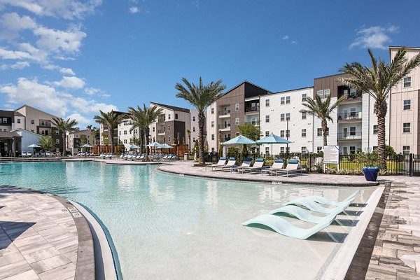 Elegant pool area with cabanas at Grand Cypress Apartments offering luxury amenities in a serene environment
