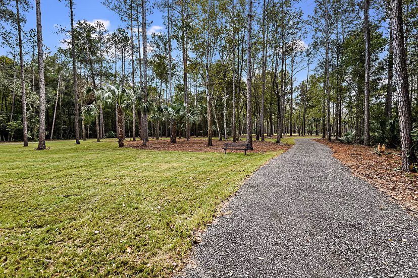 Grand Cypress Apartments: Lush green courtyard with seating areas in luxury complex