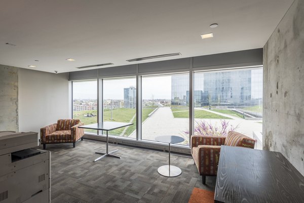 Clubhouse with modern design and ample seating at Evo at Cira Centre South Apartments