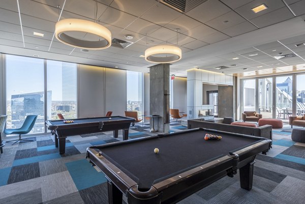 Stylish clubhouse featuring modern seating and entertainment at Evo at Cira Centre South Apartments
