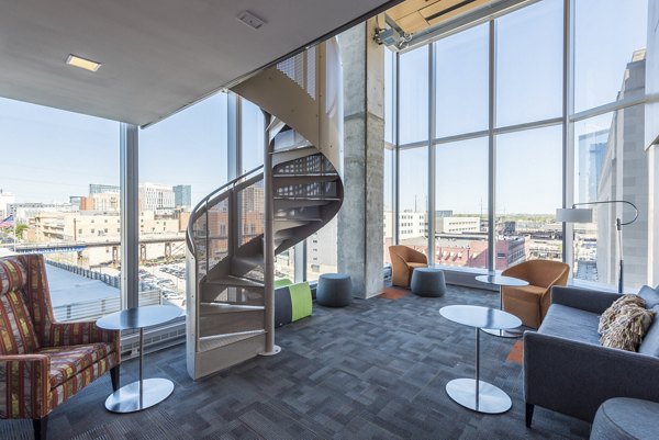 Clubhouse featuring modern design and spacious seating at Evo at Cira Centre South Apartments in Philadelphia