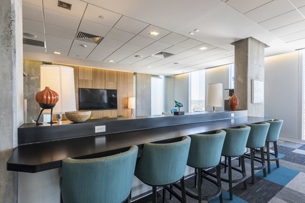 Modern clubhouse featuring sleek design and comfortable seating at Evo at Cira Centre South Apartments