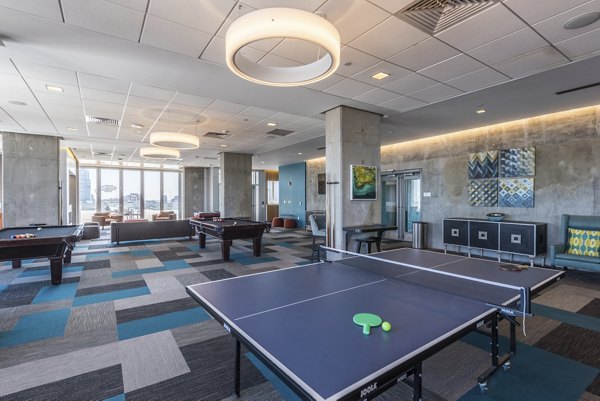 Clubhouse with modern design and ample seating at Evo at Cira Centre South Apartments