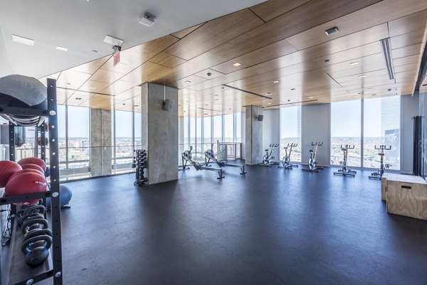 Evo at Cira Centre South Apartments: State-of-the-art fitness center with modern equipment and ample space for workouts