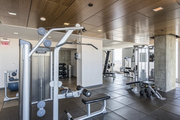 Lively fitness center with modern equipment at Evo at Cira Centre South Apartments, featuring state-of-the-art facilities for residents