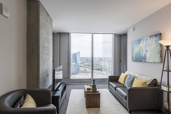 Spacious living room with modern decor in Evo at Cira Centre South Apartments