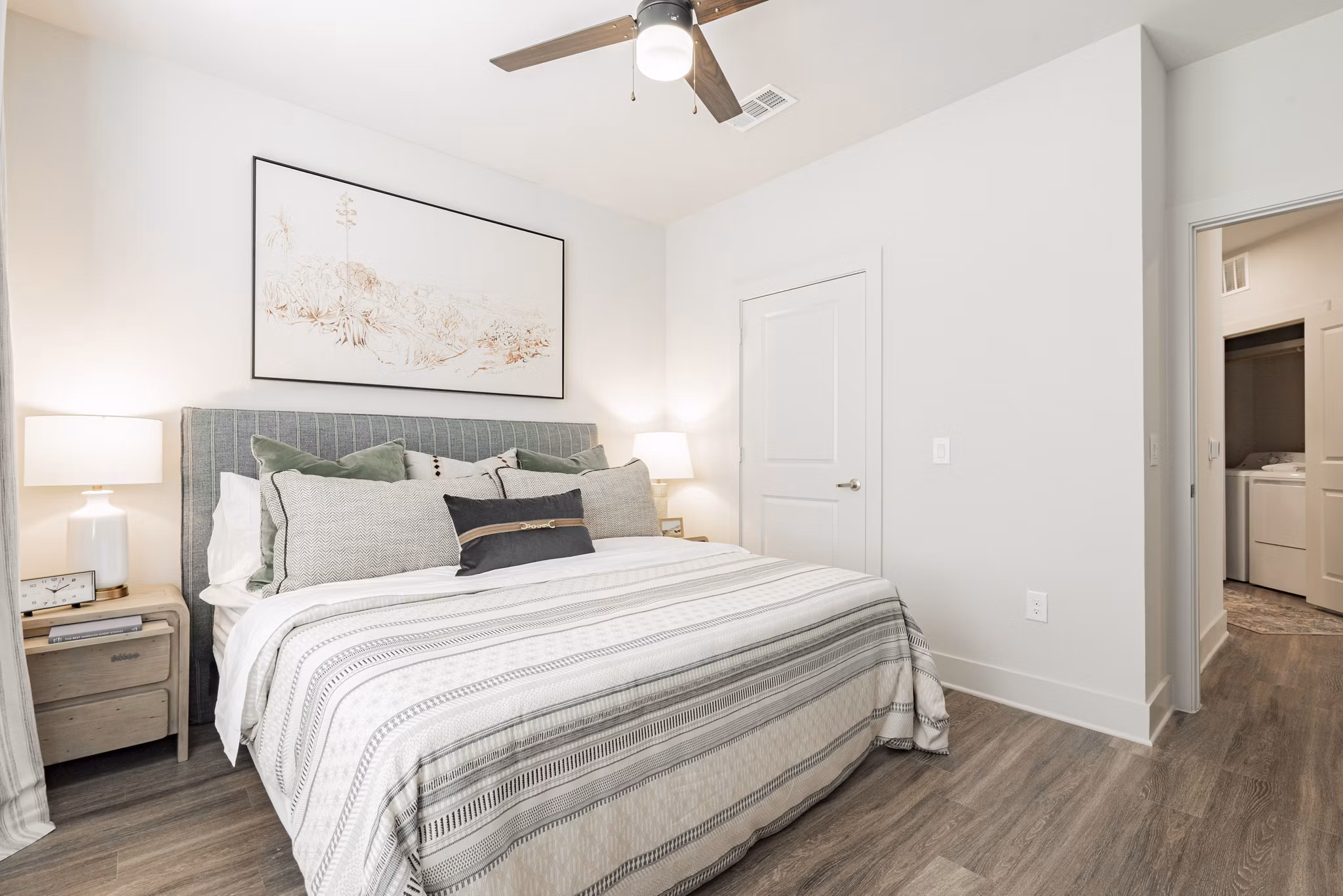 Cozy bedroom featuring modern decor at The Lyric at Keller Center Stage Apartments
