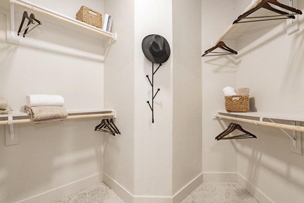 Walk-in closet with ample shelving in The Lyric at Keller Center Stage Apartments
