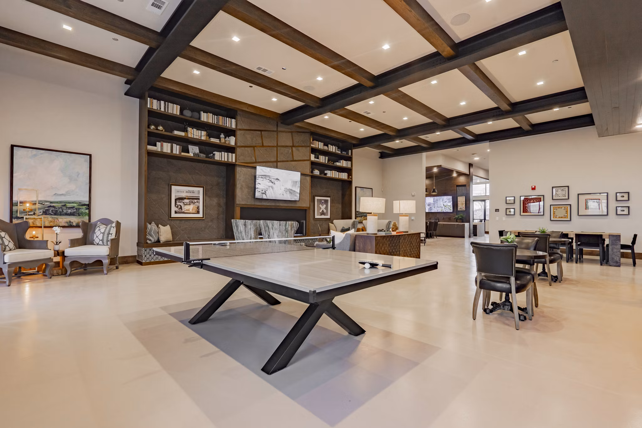 Clubhouse featuring cozy seating and modern design at The Lyric at Keller Center Stage Apartments