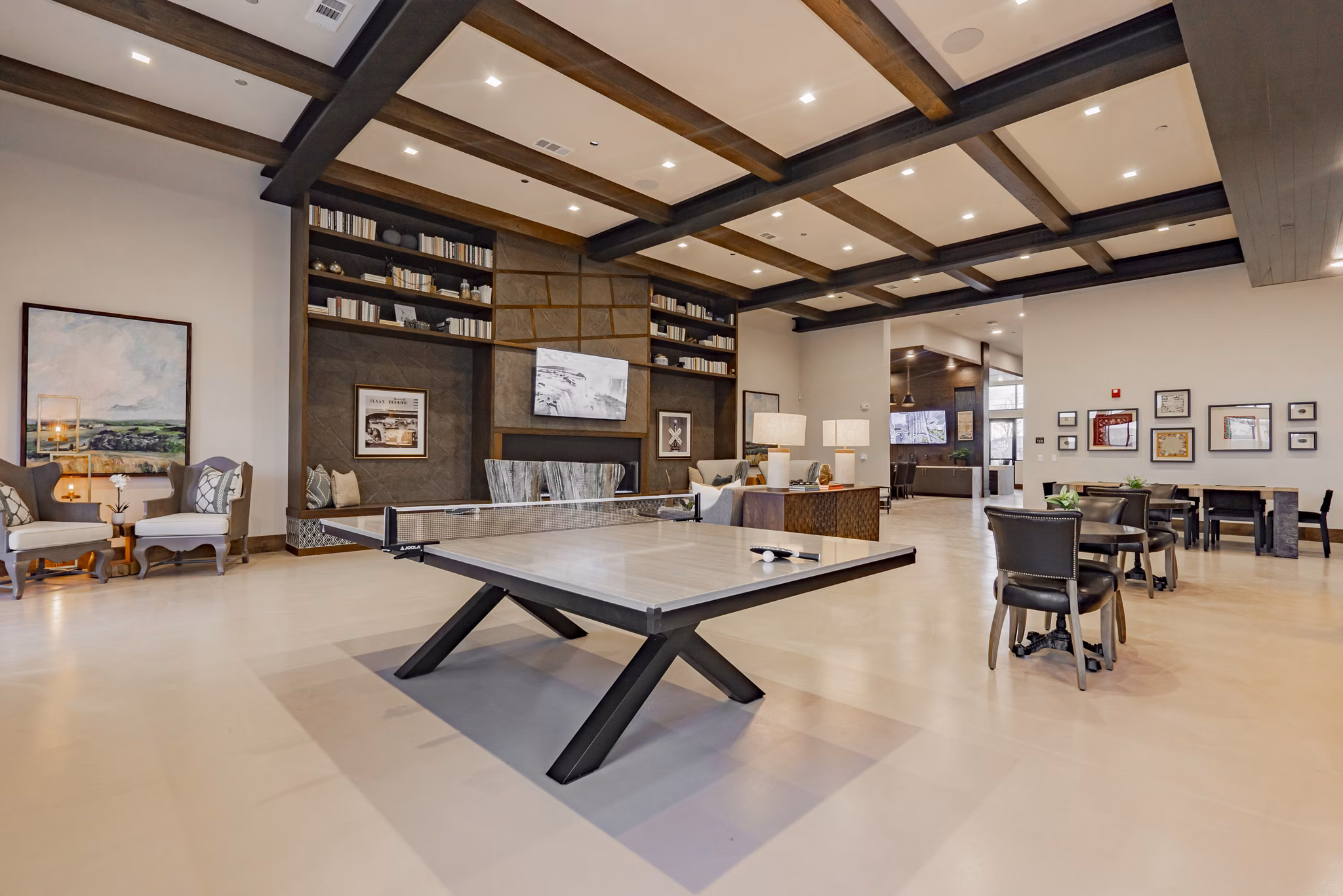 Clubhouse featuring cozy seating and modern design at The Lyric at Keller Center Stage Apartments