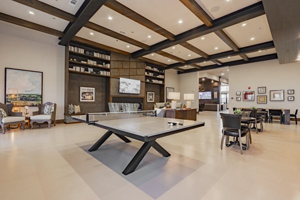 Clubhouse featuring cozy seating and modern design at The Lyric at Keller Center Stage Apartments