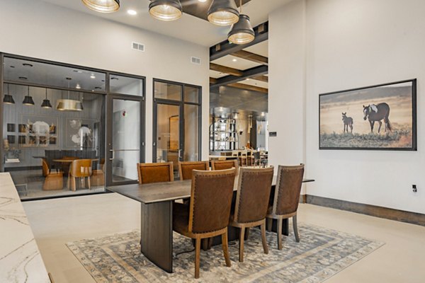Clubhouse featuring modern design with cozy seating at The Lyric at Keller Center Stage Apartments