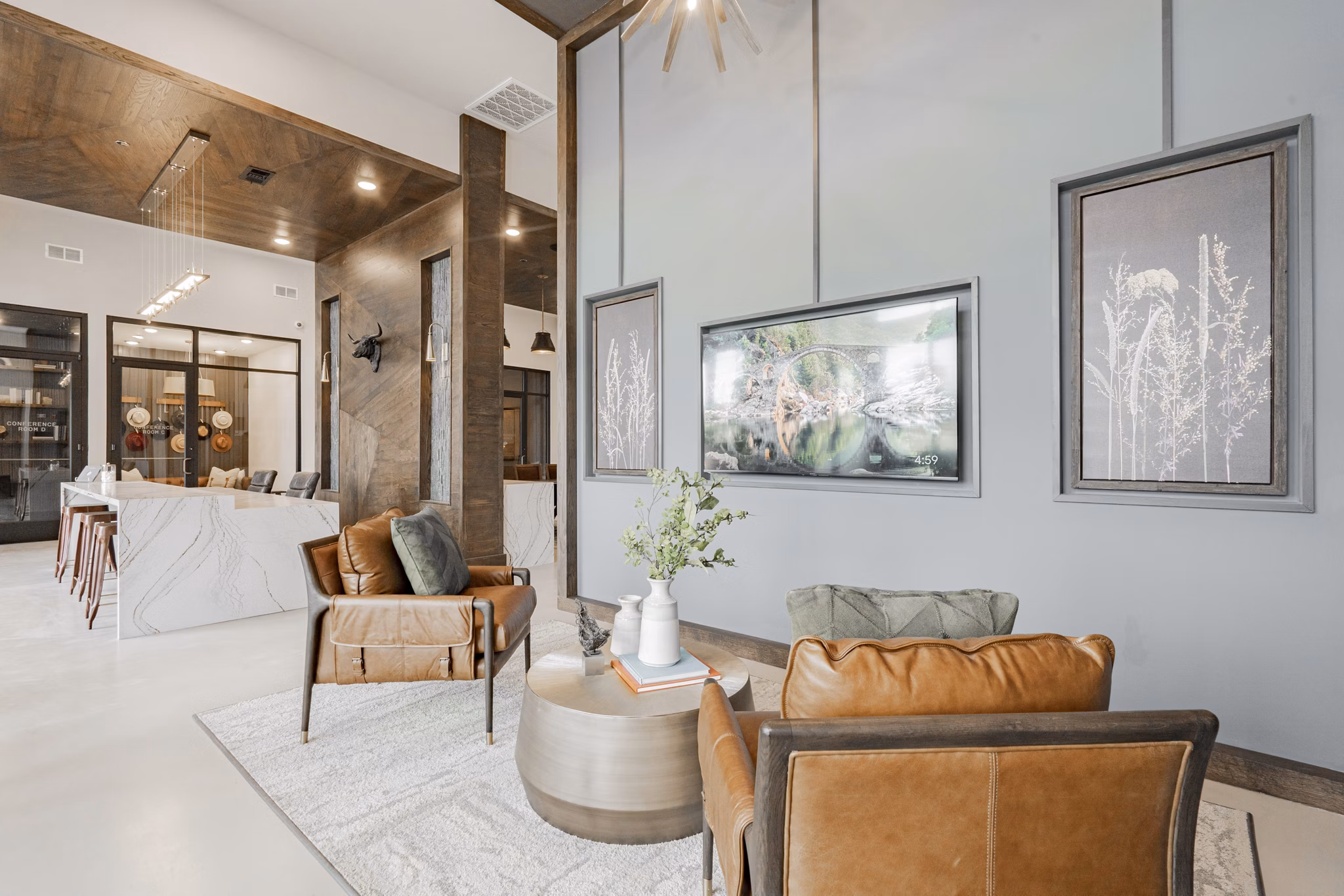 Luxurious clubhouse at The Lyric at Keller Center Stage Apartments featuring plush seating and modern decor