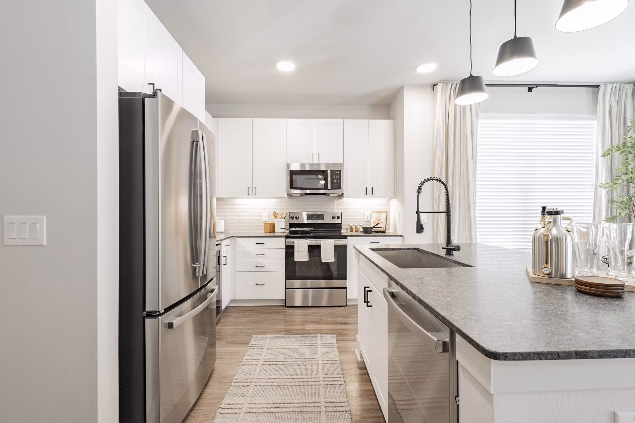 Modern kitchen with stainless steel appliances at Lenox Reserve Apartments