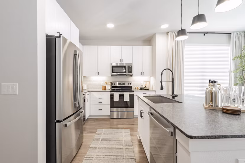 Modern kitchen with stainless steel appliances at Lenox Reserve Apartments