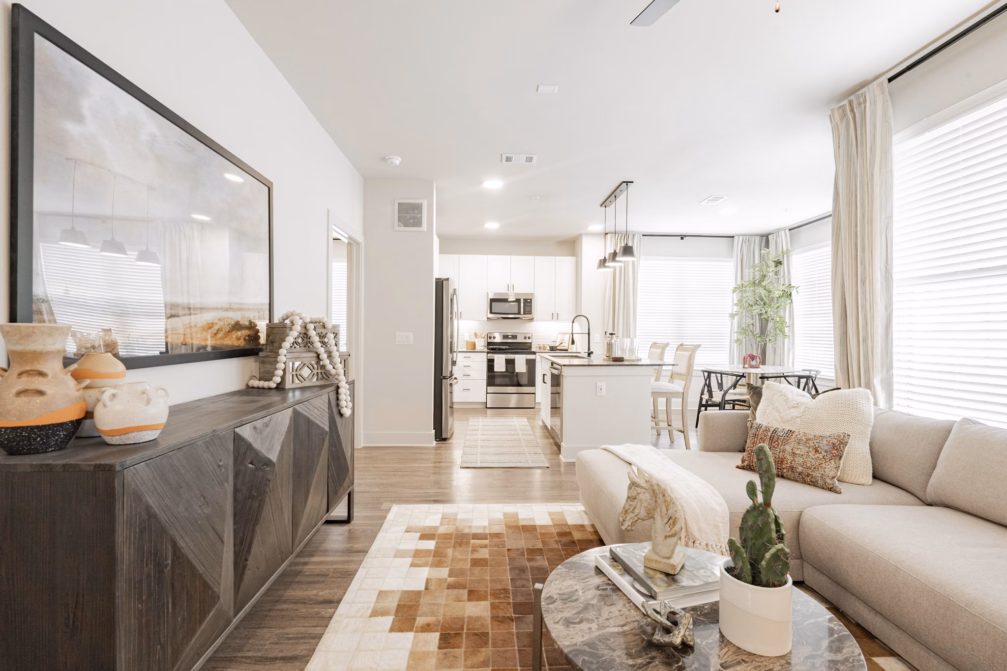 Spacious living room with modern decor in The Lyric at Keller Center Stage Townhomes