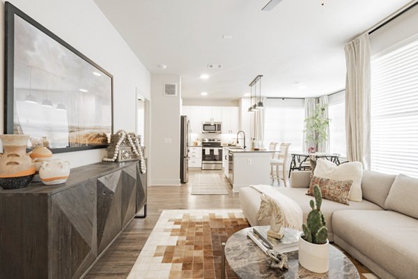 Spacious living room with modern decor in The Lyric at Keller Center Stage Townhomes