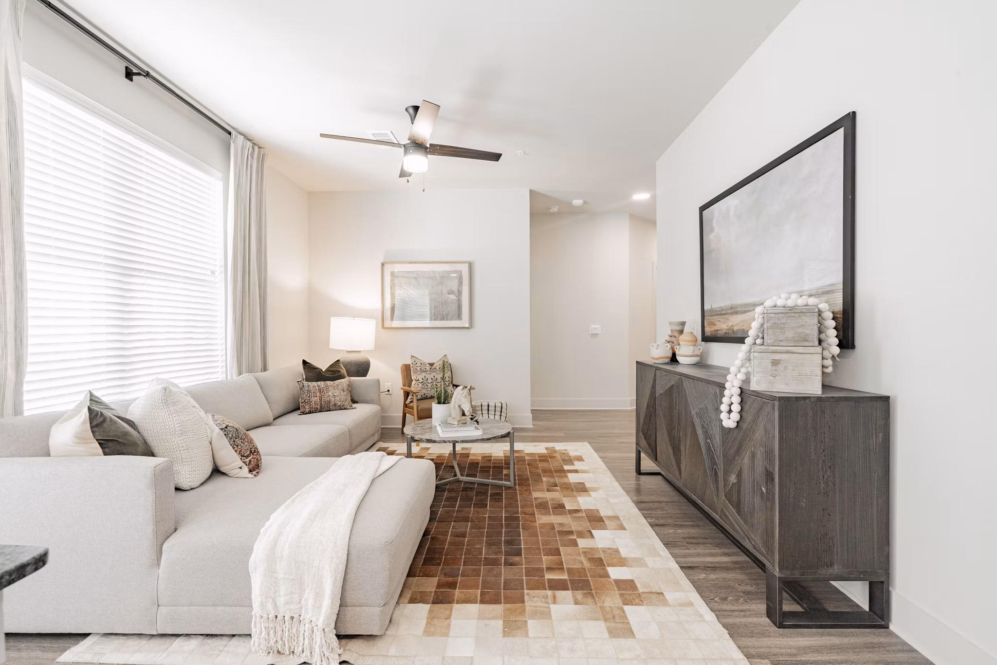 Spacious living room featuring modern decor at The Lyric at Keller Center Stage Townhomes