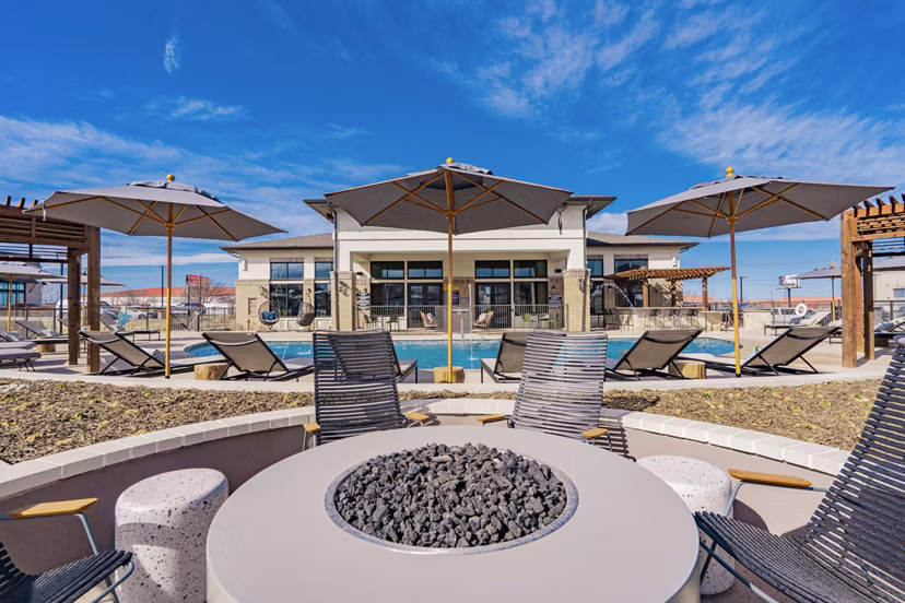 Cozy outdoor fire pit with seating at The Lyric at Keller Center Stage Apartments