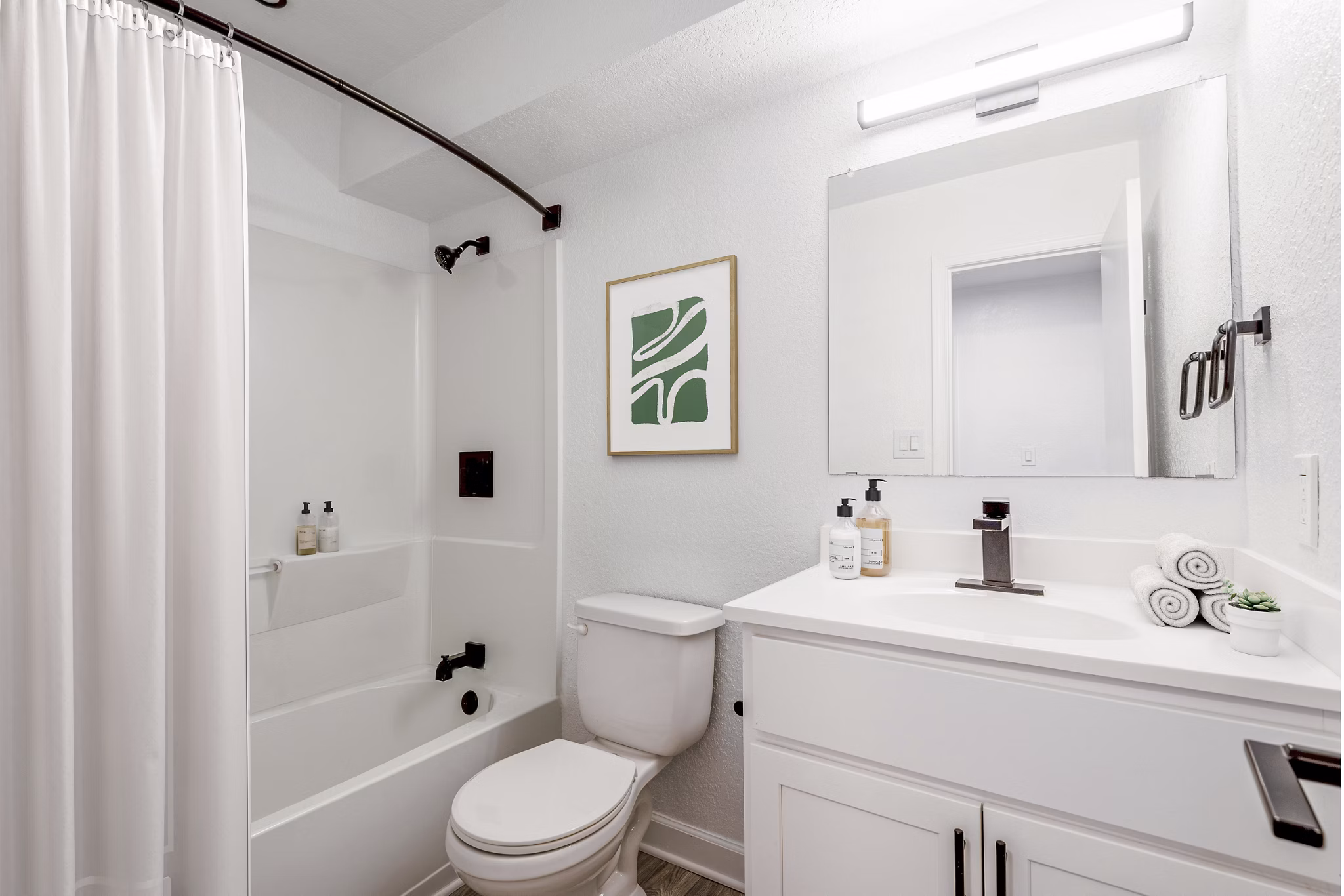 Luxurious bathroom featuring modern fixtures and elegant design in North Hill Apartments