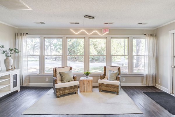 Cozy clubhouse featuring modern furnishings at North Hill Apartments for social gatherings and relaxation