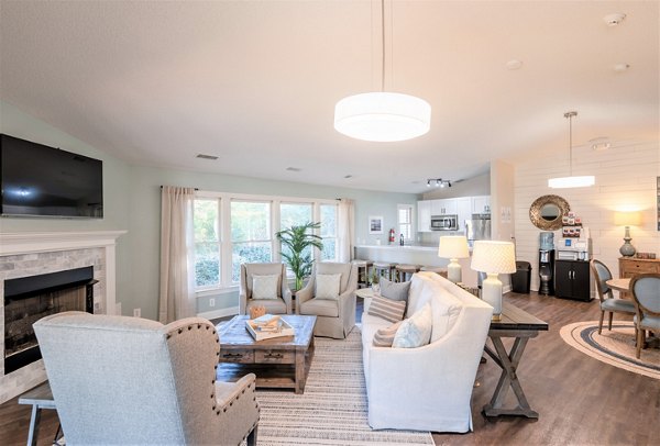 Elegant clubhouse at North Hill Apartments featuring comfortable seating and modern decor Ideal for social gatherings and community events