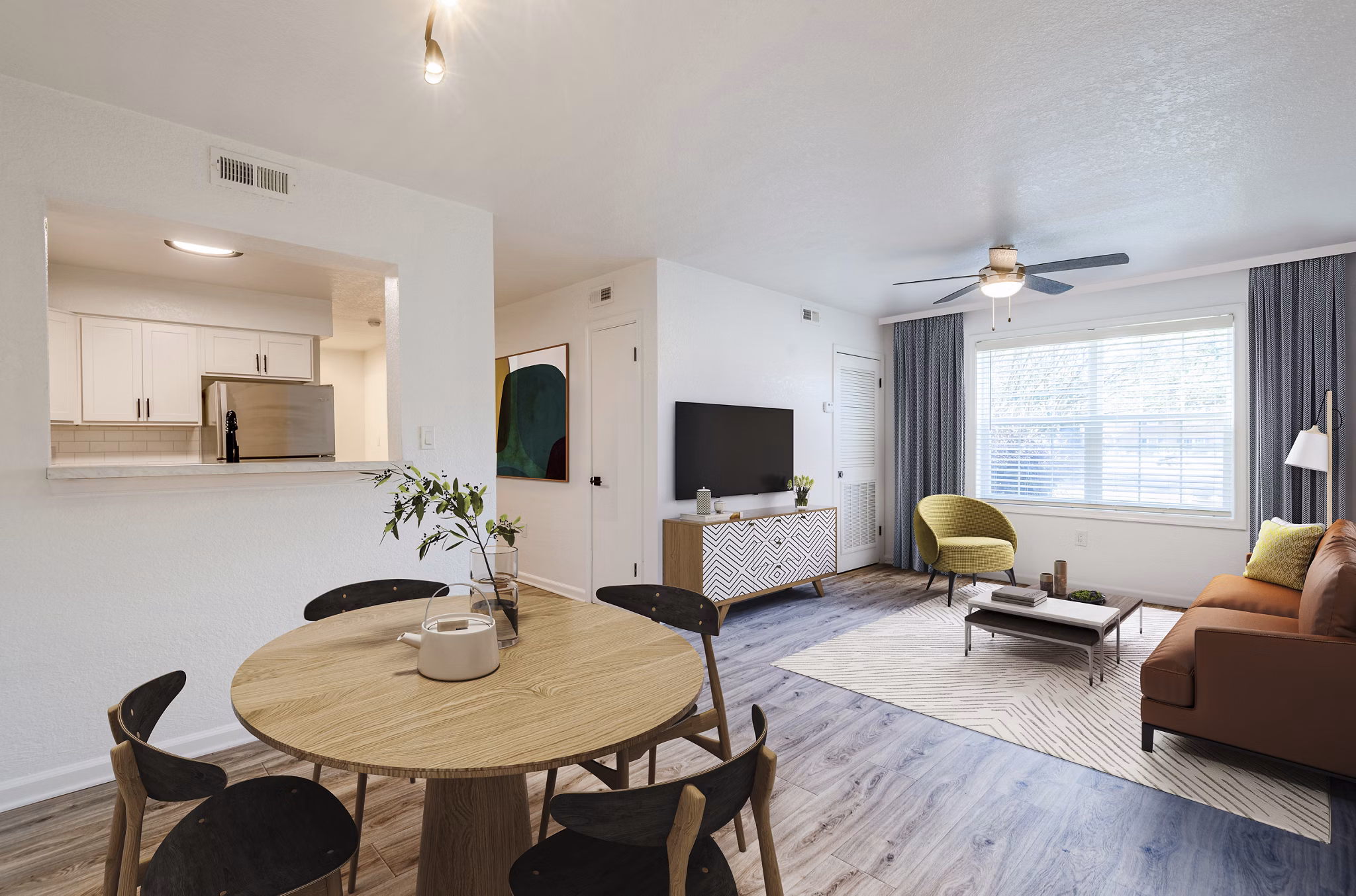 Elegant dining area with sleek furniture and modern lighting in North Hill Apartments