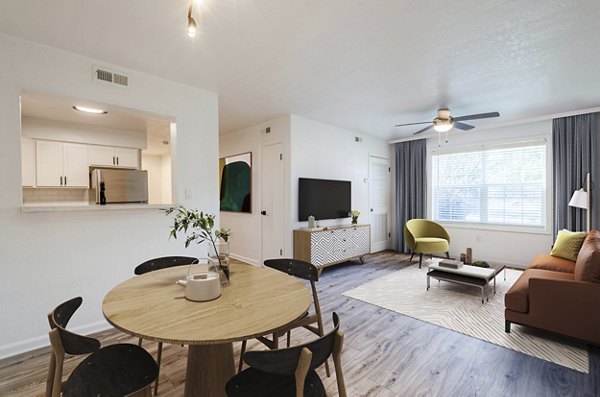 Elegant dining area with sleek furniture and modern lighting in North Hill Apartments