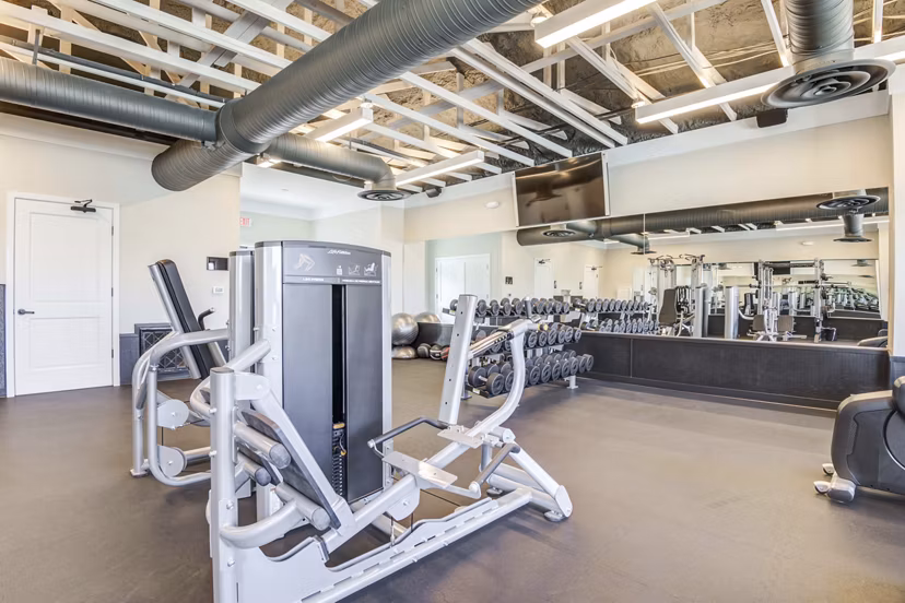 Modern fitness center equipped with state-of-the-art machines at North Hill Apartments