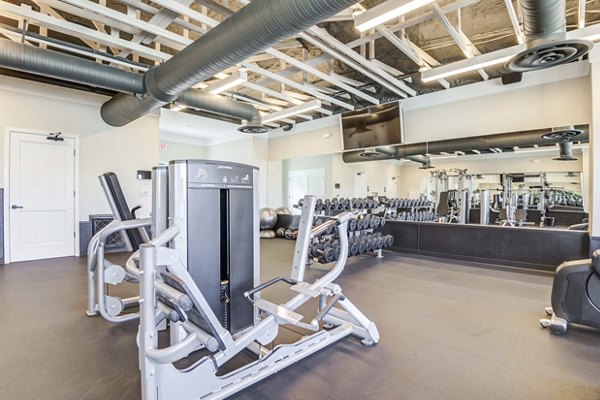 Modern fitness center equipped with state-of-the-art machines at North Hill Apartments