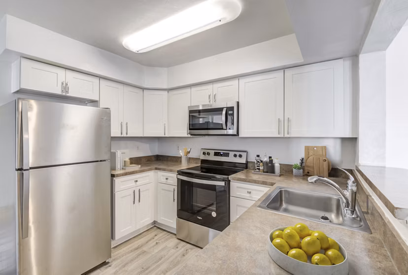 Modern kitchen featuring stainless steel appliances at North Hill Apartments